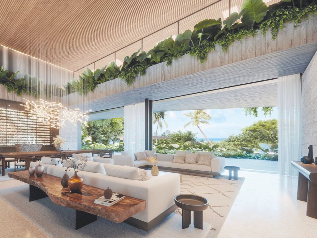 Luxury living room with ocean view, featuring modern furniture and lush greenery, inspired by Fumba Town, Zanzibar.